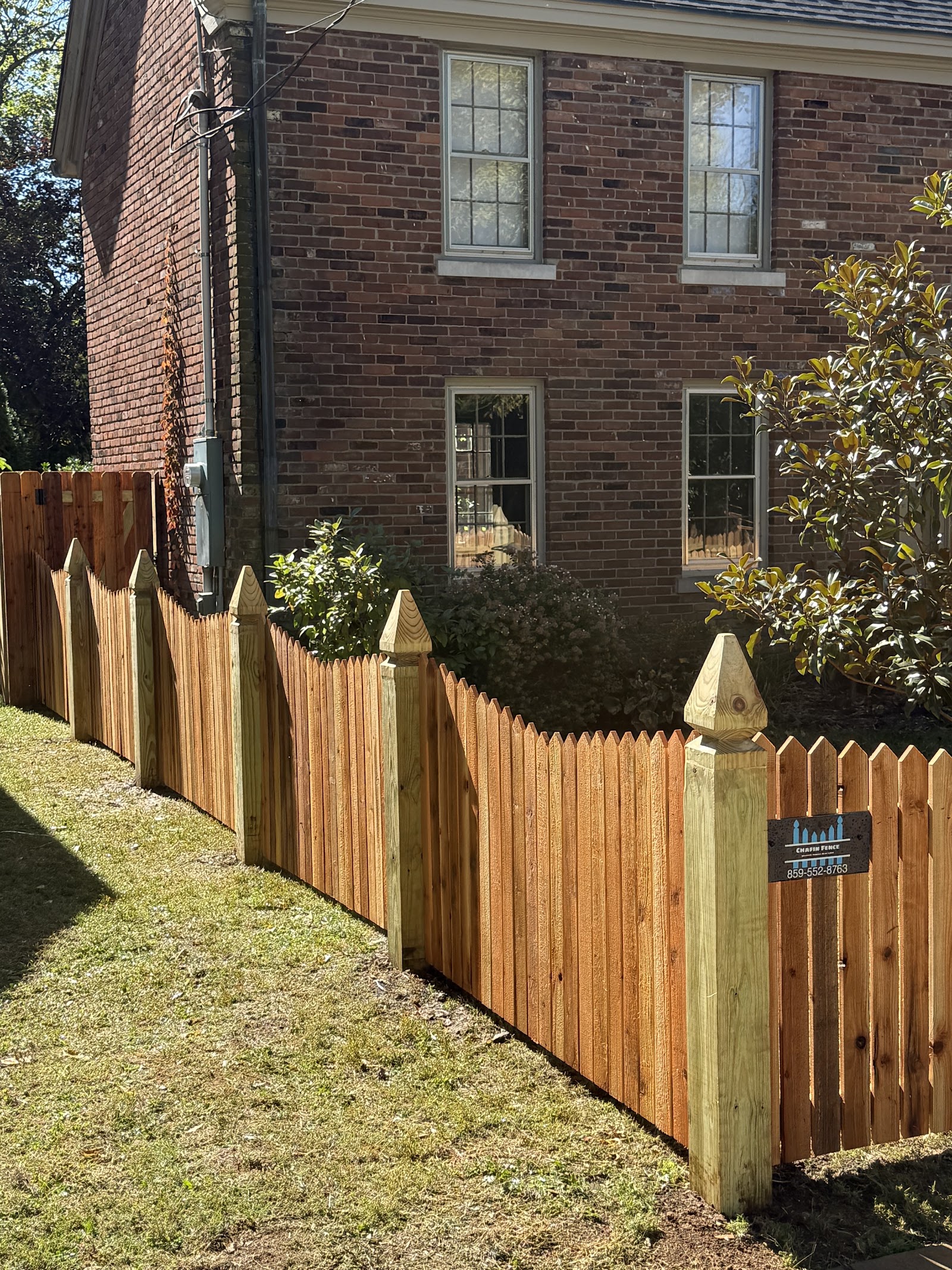 Wood picket fence and matching pedestrian gate