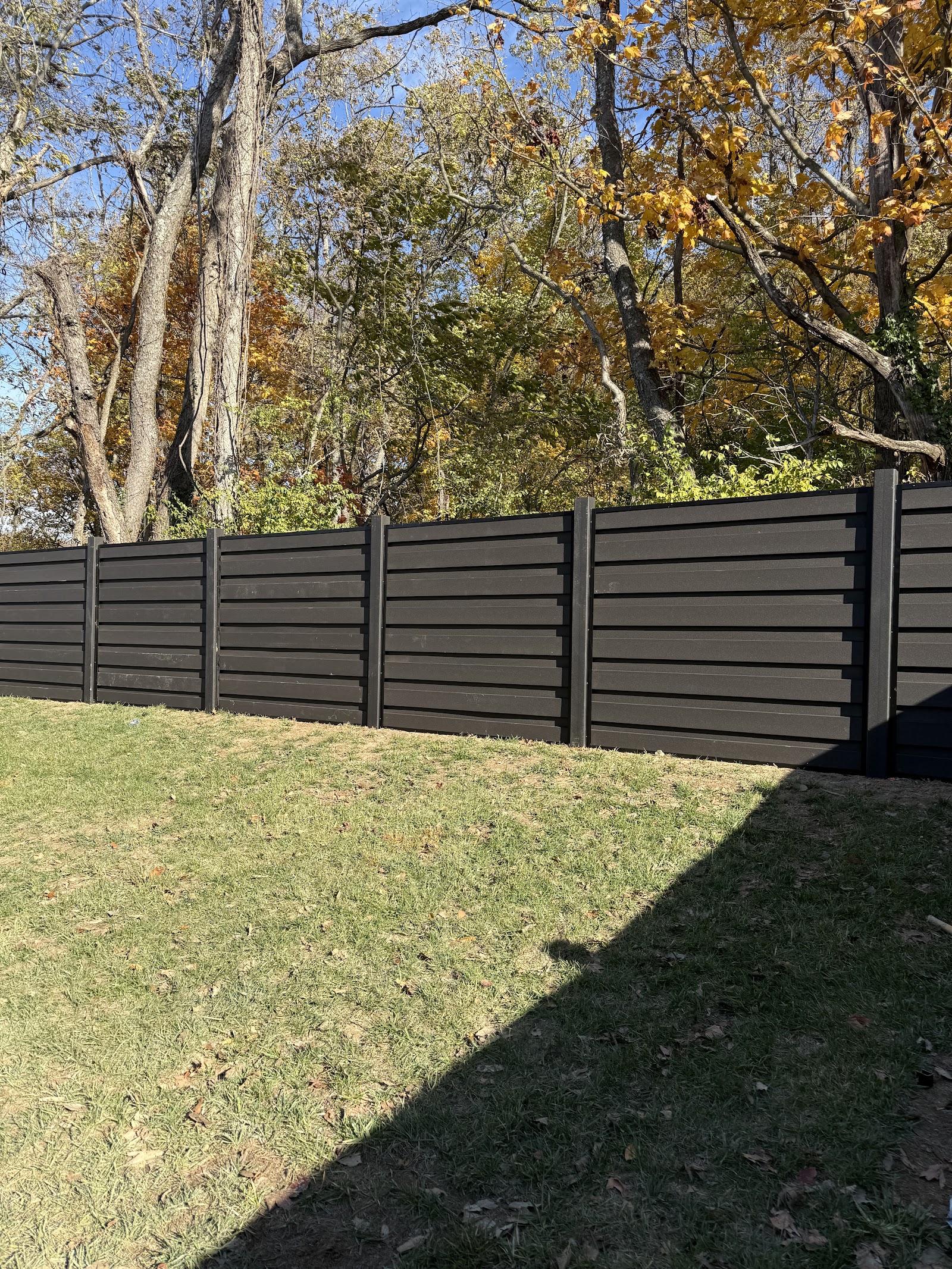 Dark horizontal composite privacy fence
